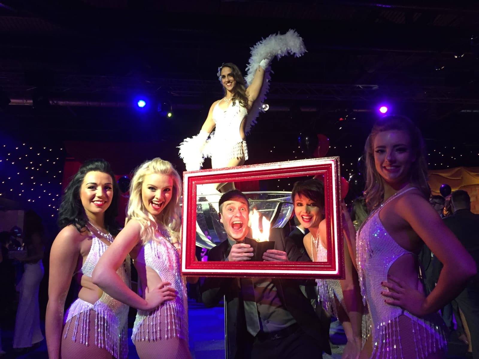 James Anthony stage show production with showgirls and dramatic lighting