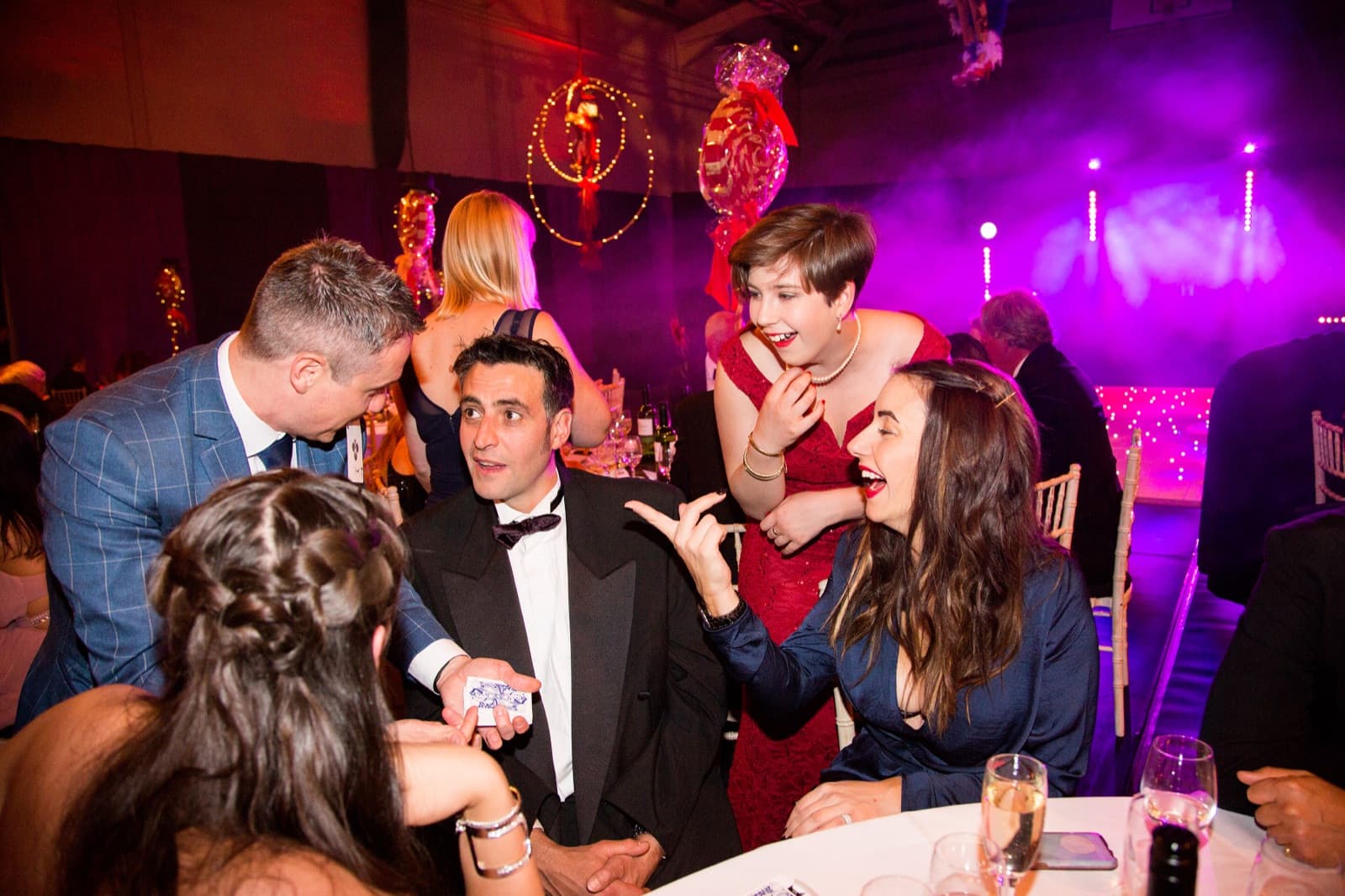 Close-up magic at a gala dinner
