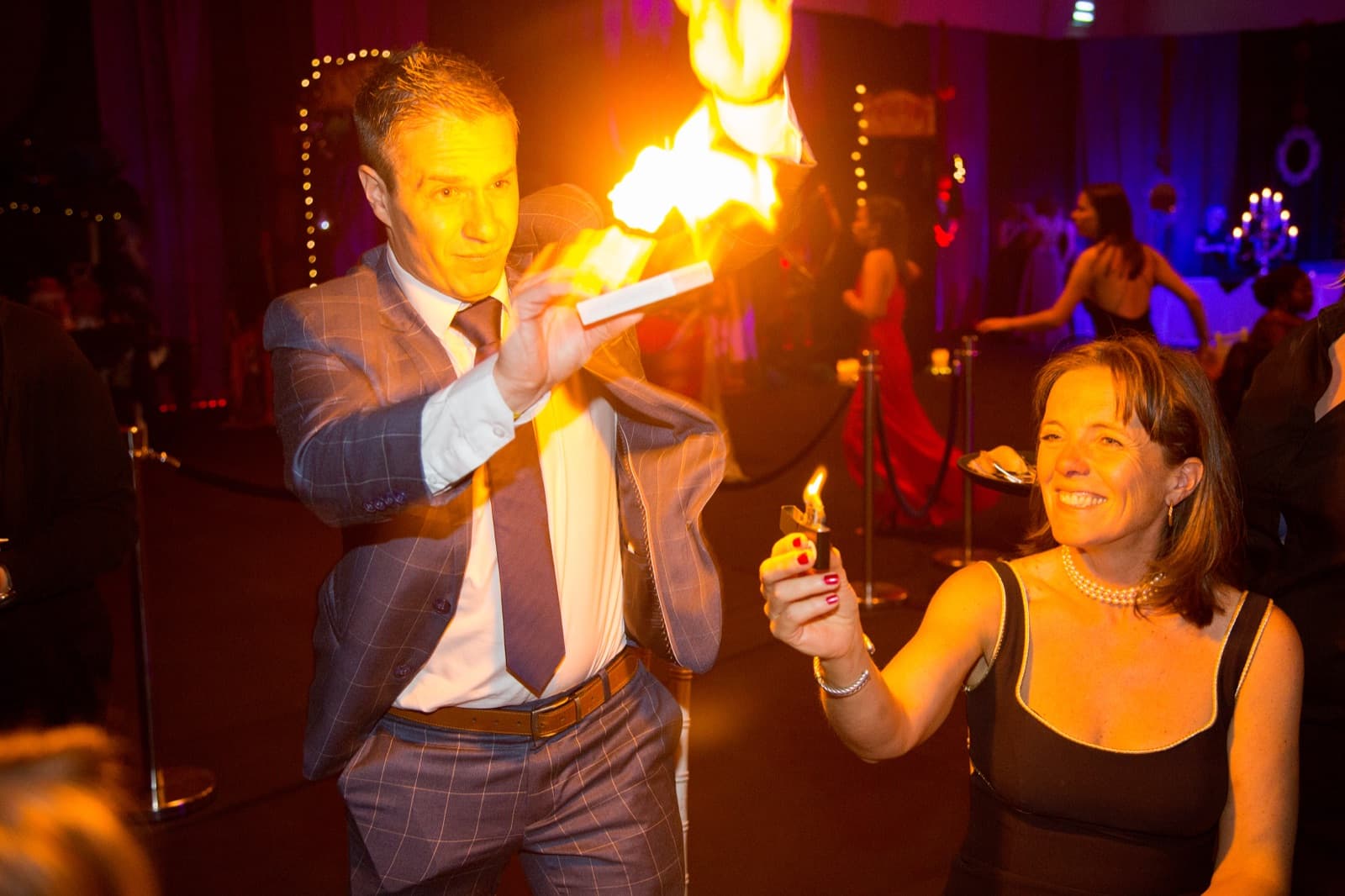 James Anthony performing fire magic for guests at a corporate gala dinner