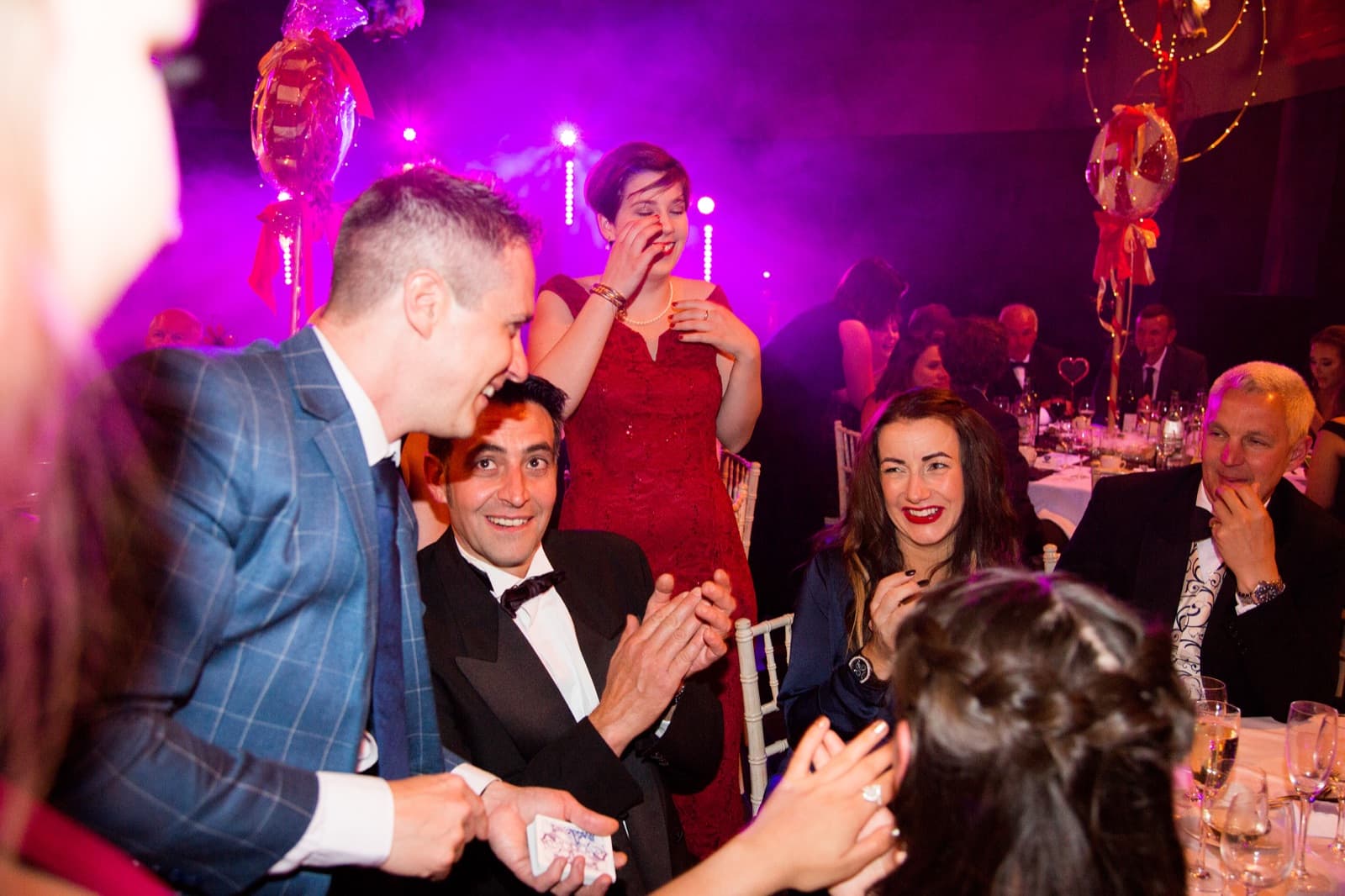 James Anthony performing for a group of guests at a corporate gala