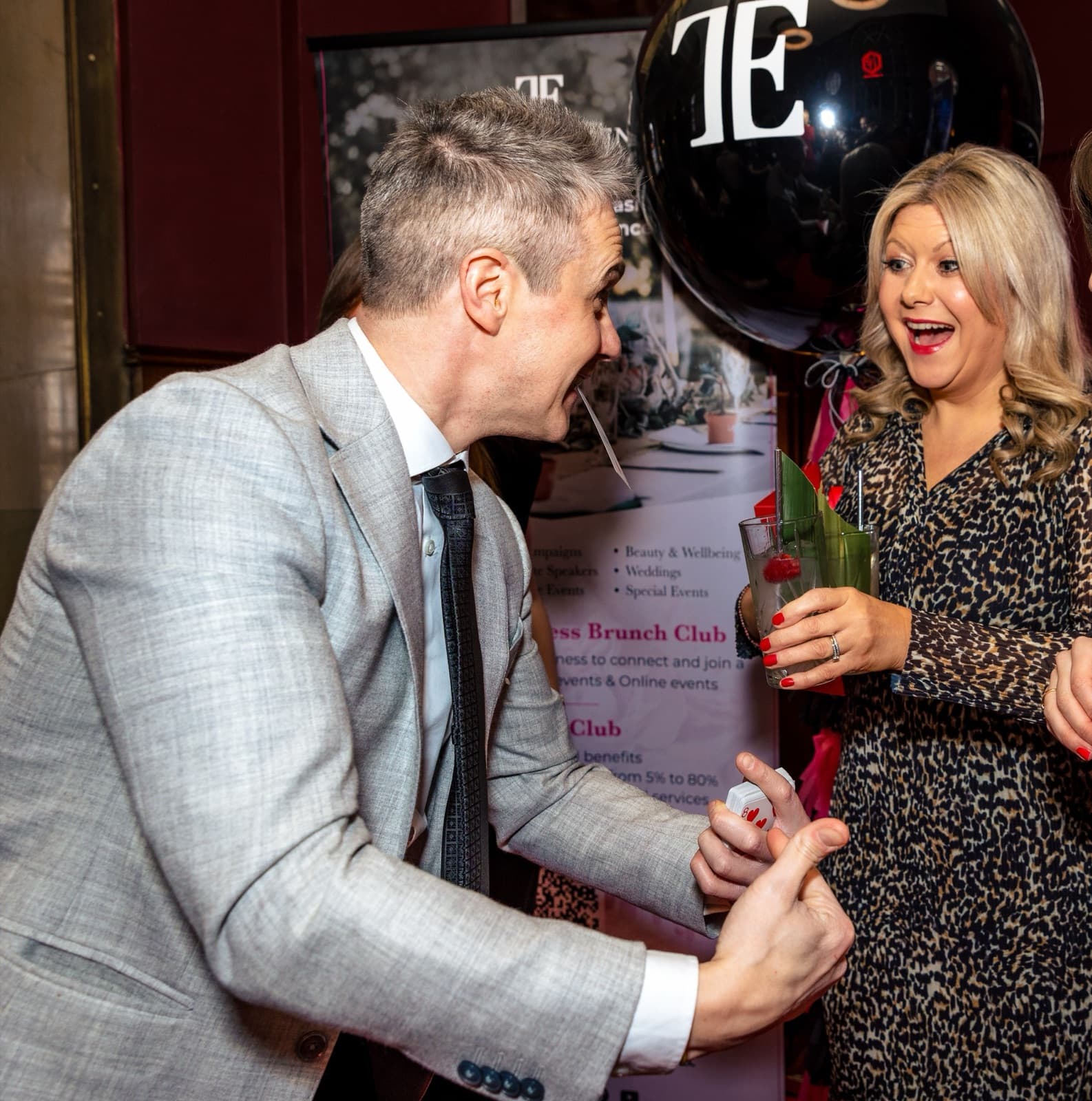 James Anthony performing close-up magic for guests at a private dinner