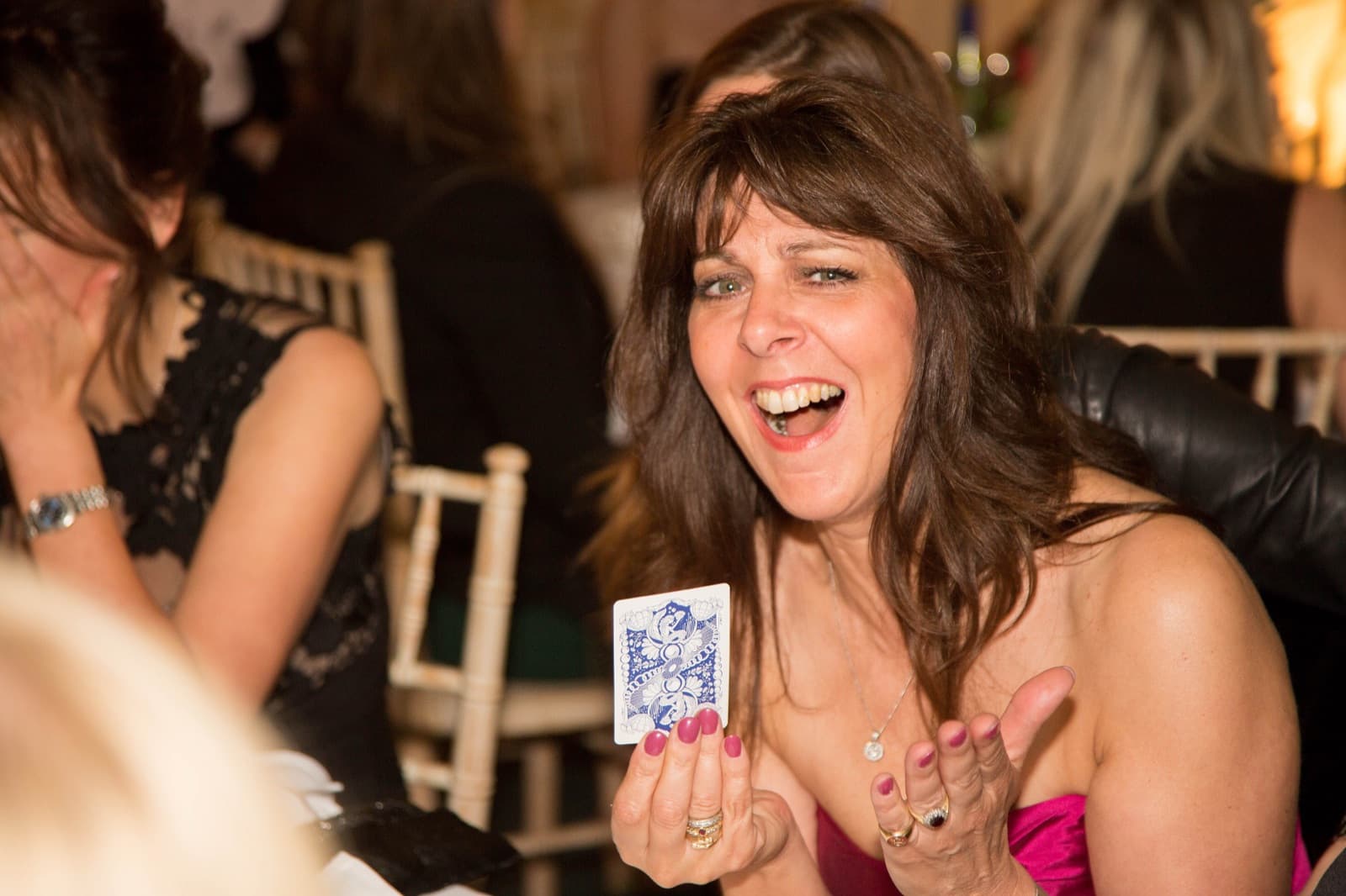 Prom guest laughing at a magic trick
