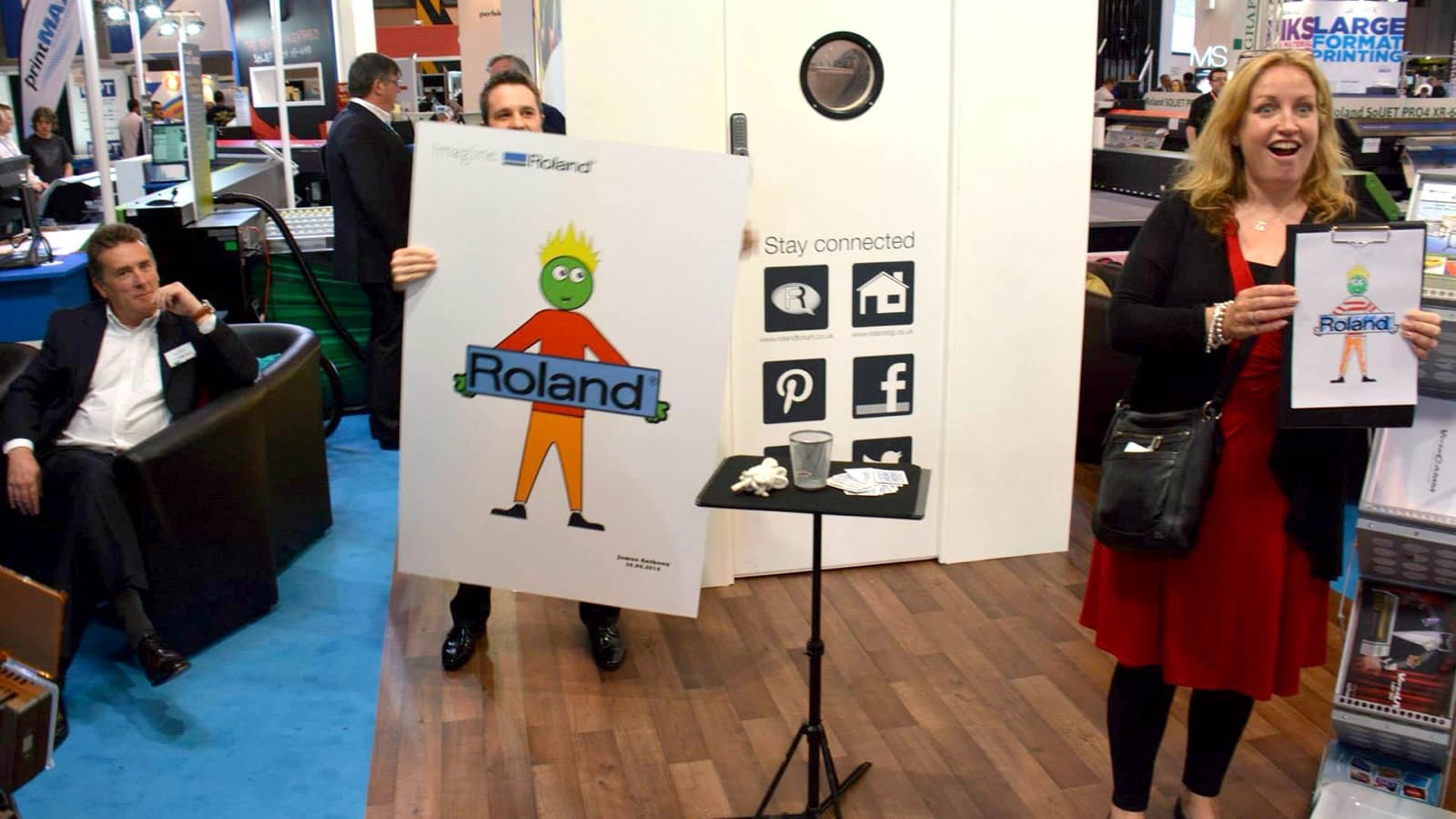 Brand-integrated magic with a Roland logo at a trade show