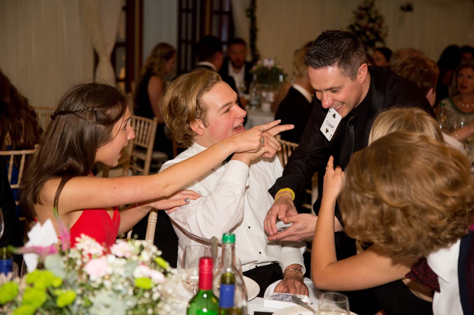 Card in mouth trick at wedding