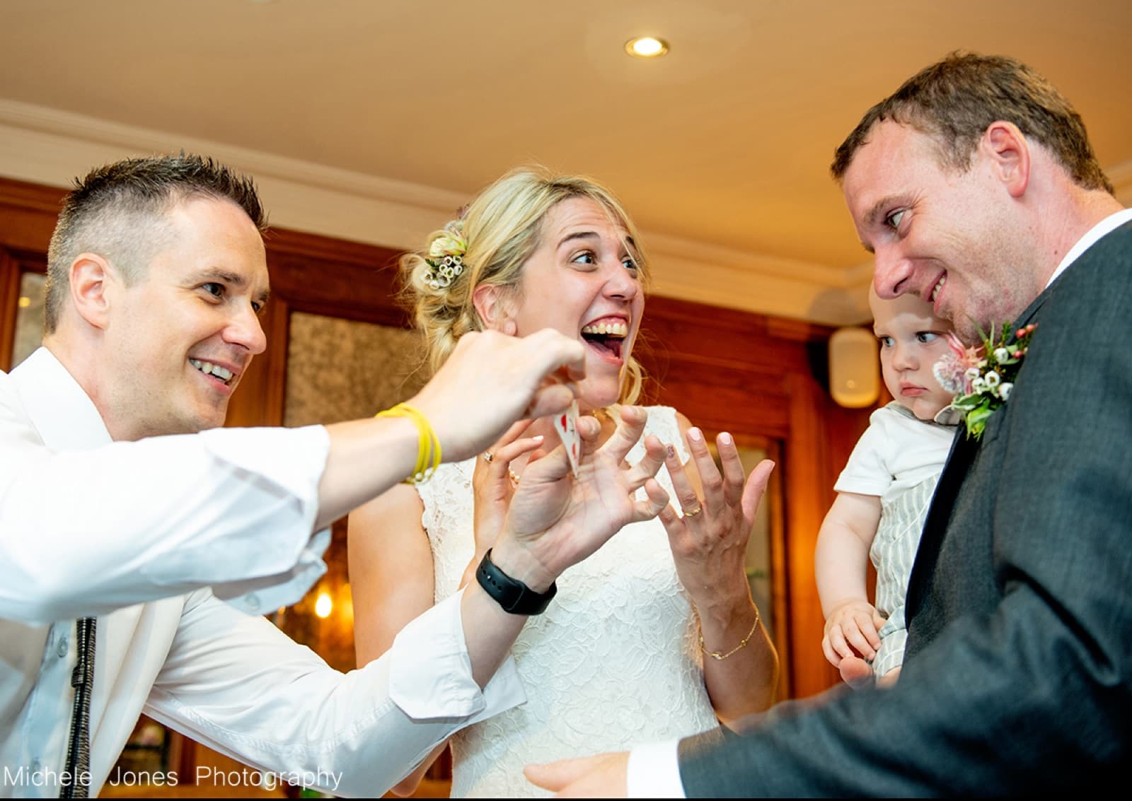 A bride enjoying a card trick