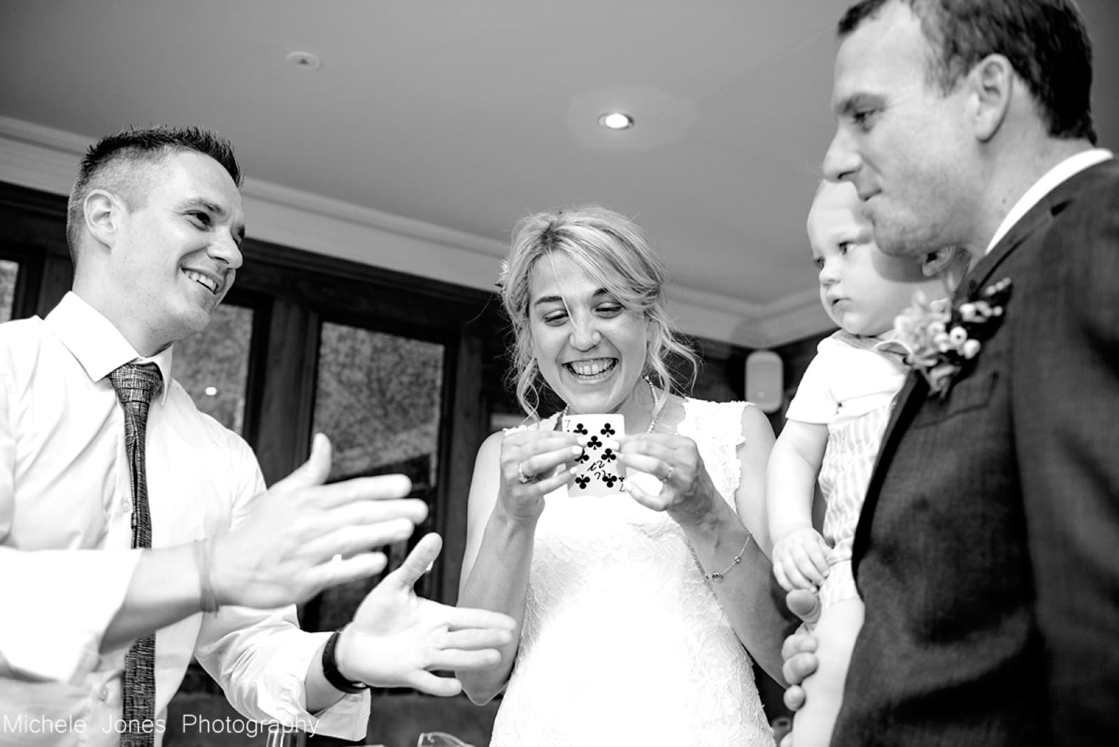 Bride and groom amazed by close-up magic at their wedding
