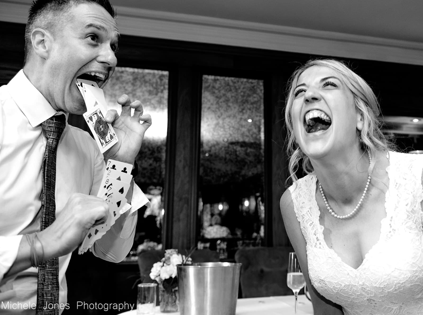 A bride laughing at a magic trick