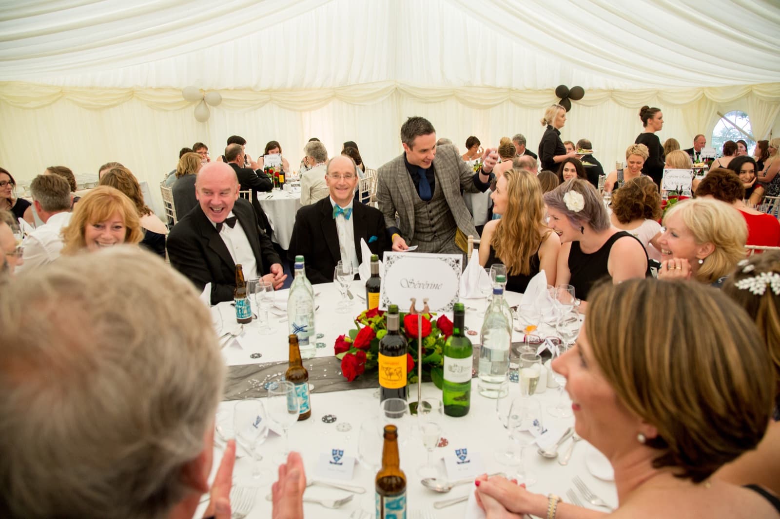 Wedding guests laughing at magic